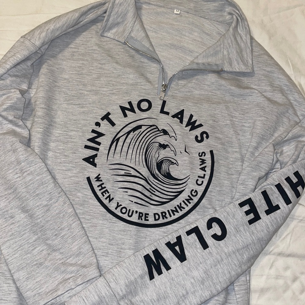 Brand new White claw quarter zip. Size medium.